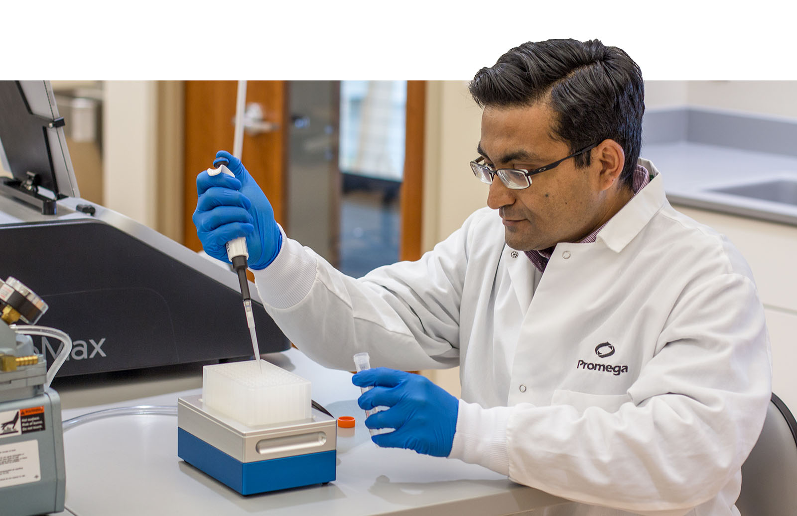 Promega scientist testing Water glo ATP Assay